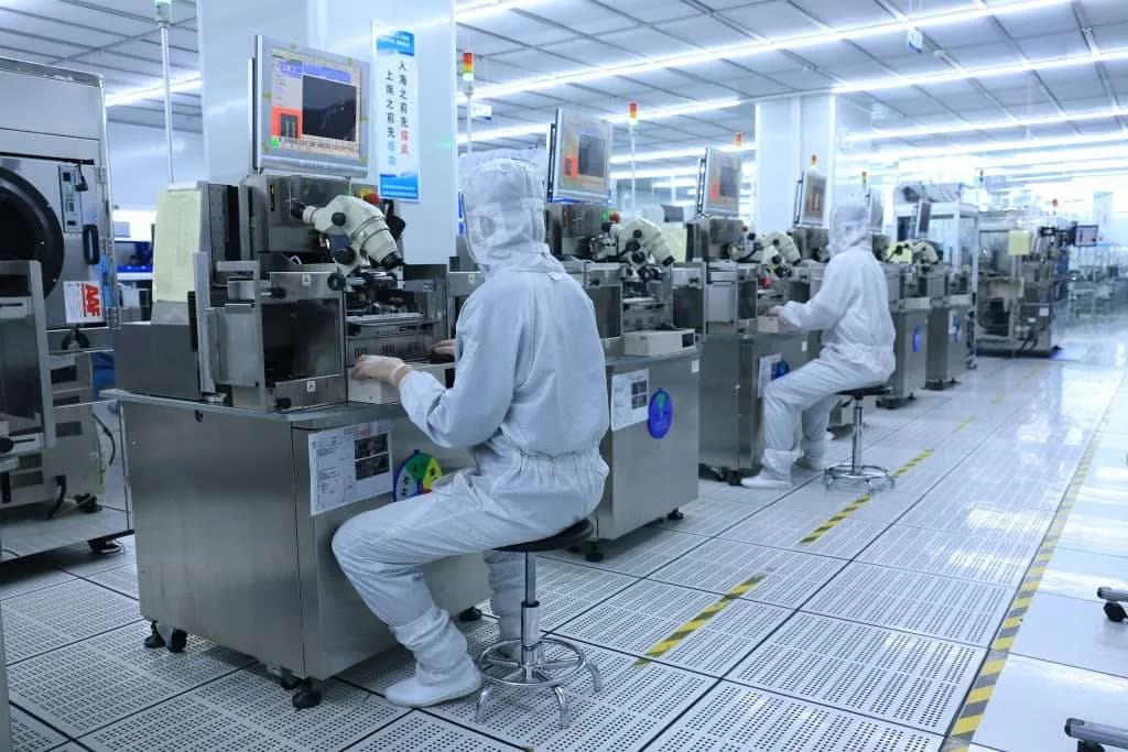 Camera module production in a cleanroom manufacturing facility